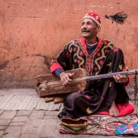 Musician plying his trade in the medina, Marrakesh | Richard I'Anson