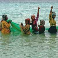 Local women celebrate a successful fishing expedition | Christa Cameron