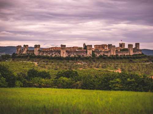 The walled town of Monteriggioni sits dramatically in the Tuscan landscape |  Tim Charody