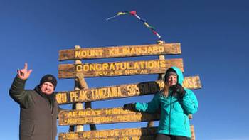Celebrating on the summit of Mount Kilimanjaro | Georgia Canning