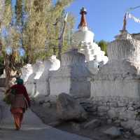 Walking past ancient chortens in Leh, Ladakh, where tradition and spirituality are deeply woven into daily life. | Garry Weare