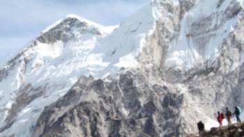 Trekkers dwarfed by the mountains of the Everest Region in Nepal | Ayla Rowe